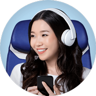 a woman wearing headphones onboard a plane