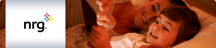 NRG logo with photo of mother and child in bed playing on electronic tablet