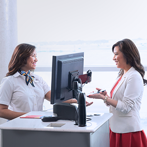 Image of woman using mobile boarding pass at the gate